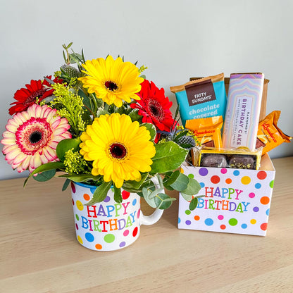 Colorful Mug Arrangement with Birthday Treats –  Ballard Blossom Inc, Seattle WA